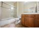 Bathroom boasts wood cabinets and a shower/tub combo at 2149 Cedar River Ct, Henderson, NV 89044