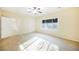 Spacious bedroom with ceiling fan and access to hallway at 2149 Cedar River Ct, Henderson, NV 89044