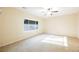 Bright bedroom with ceiling fan and large window at 2149 Cedar River Ct, Henderson, NV 89044