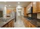 Modern kitchen with stainless steel appliances and light wood cabinets at 2149 Cedar River Ct, Henderson, NV 89044