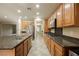 Modern kitchen with stainless steel appliances and light wood cabinets at 2149 Cedar River Ct, Henderson, NV 89044