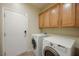 Laundry room with washer, dryer, and cabinets at 2149 Cedar River Ct, Henderson, NV 89044