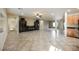 Open concept living room with tile floors and built-in shelving at 2149 Cedar River Ct, Henderson, NV 89044