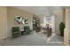 Virtually staged home office with a desk and comfortable seating at 2149 Cedar River Ct, Henderson, NV 89044