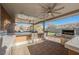 Outdoor kitchen with grill, sink, and seating area at 2149 Cedar River Ct, Henderson, NV 89044