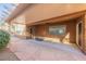 Covered patio with stone flooring and ceiling fan at 2149 Cedar River Ct, Henderson, NV 89044