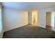 Bright carpeted bedroom with neutral walls and large window at 2606 S Durango Dr # 171, Las Vegas, NV 89117