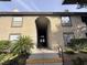 Building entryway with stairs and a walkway, featuring lush landscaping at 2606 S Durango Dr # 171, Las Vegas, NV 89117