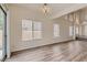 Bright dining room with wood-look floors and large windows at 2636 Golden Sands Dr, Las Vegas, NV 89128