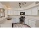 Kitchen with white cabinets, stainless steel appliances, and quartz countertops at 2636 Golden Sands Dr, Las Vegas, NV 89128