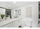 Modern bathroom boasts a white vanity with quartz countertop at 3111 Bel Air Dr # 7F, Las Vegas, NV 89109