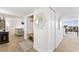 Entryway with built-in bench, hexagon mirror, and light wood floors at 3111 Bel Air Dr # 7F, Las Vegas, NV 89109