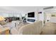 Bright living room featuring a fireplace, TV, comfortable seating, and access to an outdoor balcony with city views at 3111 Bel Air Dr # 7F, Las Vegas, NV 89109