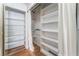 Large closet with built-in shelving and a mirrored door at 3151 Soaring Gulls Dr # 1170, Las Vegas, NV 89128