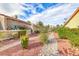 Landscaped pathway with rock features and desert plants at 3262 Mystic Ridge Ct, Las Vegas, NV 89129