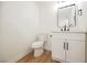 Modern bathroom with white vanity, black matte fixtures, and stylish mirror at 3366 Loma Linda Ln, Las Vegas, NV 89121