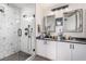 Bright bathroom featuring a glass-enclosed shower and dual sink vanity at 353 E Bonneville Ave # 632, Las Vegas, NV 89101