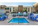 Community hot tub with blue chairs and building at 353 E Bonneville Ave # 632, Las Vegas, NV 89101