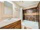 Clean bathroom with tub shower combo and wood vanity at 376 N 15Th St, Las Vegas, NV 89101