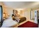 Bright bedroom with queen bed, chaise lounge, and large closet at 376 N 15Th St, Las Vegas, NV 89101