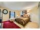 Spacious bedroom with a queen-size bed, a comfy chaise lounge, and a red rug at 376 N 15Th St, Las Vegas, NV 89101