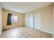 Simple bedroom with tile floors and mirrored closet doors at 376 N 15Th St, Las Vegas, NV 89101