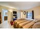 Comfortable bedroom with a queen bed, access to bathroom, and a TV stand at 376 N 15Th St, Las Vegas, NV 89101