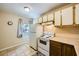 Galley kitchen with white appliances and wood cabinets at 376 N 15Th St, Las Vegas, NV 89101