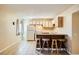 Cozy kitchen with wood cabinets, a breakfast bar, and tile floors at 376 N 15Th St, Las Vegas, NV 89101