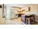 Bright kitchen with wood cabinets, white appliances, and a breakfast bar at 376 N 15Th St, Las Vegas, NV 89101