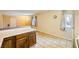 Kitchen with light wood cabinets, white appliances, and tile floors at 376 N 15Th St, Las Vegas, NV 89101