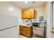Small kitchen with microwave, cabinets, and a refrigerator at 376 N 15Th St, Las Vegas, NV 89101