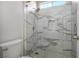 Modern bathroom with marble shower surround and glass enclosure at 4119 Amberdale Ave, North Las Vegas, NV 89031