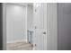 Clean and simple bathroom with gray vanity and white door at 4119 Amberdale Ave, North Las Vegas, NV 89031