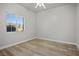 Bright bedroom featuring light walls and wood-look flooring at 4119 Amberdale Ave, North Las Vegas, NV 89031