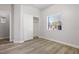 Spacious bedroom with wood-look flooring and a large closet at 4119 Amberdale Ave, North Las Vegas, NV 89031