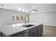 Kitchen island with marble countertop, sink, and modern faucet at 4119 Amberdale Ave, North Las Vegas, NV 89031