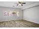 Bright living room featuring hardwood floors and a ceiling fan at 4119 Amberdale Ave, North Las Vegas, NV 89031