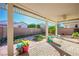 Covered patio with brick pavers and ceiling fan at 4119 Amberdale Ave, North Las Vegas, NV 89031