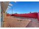 Large backyard with desert landscaping and red block wall at 4123 Redfield Ave, North Las Vegas, NV 89032