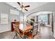 Dining room with wooden table and chairs, open to kitchen at 4123 Redfield Ave, North Las Vegas, NV 89032