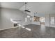 Open floor plan living room featuring a fireplace, tile floors, and plenty of natural light at 4123 Redfield Ave, North Las Vegas, NV 89032