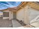 Front entry with security door and walkway to garage at 4688 Belshire Dr, Las Vegas, NV 89147