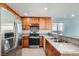 Kitchen with stainless steel appliances and wood cabinets at 4688 Belshire Dr, Las Vegas, NV 89147