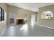 Living room showcasing a fireplace, kitchen, and flooring at 4752 Obannon Dr # D, Las Vegas, NV 89102