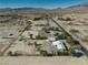 Wide aerial shot of a community with spacious desert lots, showing overall layout and mountain views at 561 Jarvis Rd, Pahrump, NV 89060