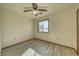 Well-lit bedroom with wood floors and window at 561 Jarvis Rd, Pahrump, NV 89060