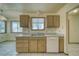 Kitchen with wood cabinets, double sink, and dishwasher at 561 Jarvis Rd, Pahrump, NV 89060