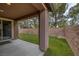 View of covered patio overlooking fenced yard with verdant turf at 5625 Galivan Vista St, North Las Vegas, NV 89081