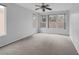 Bright bedroom with natural light from large windows and neutral carpet at 5625 Galivan Vista St, North Las Vegas, NV 89081